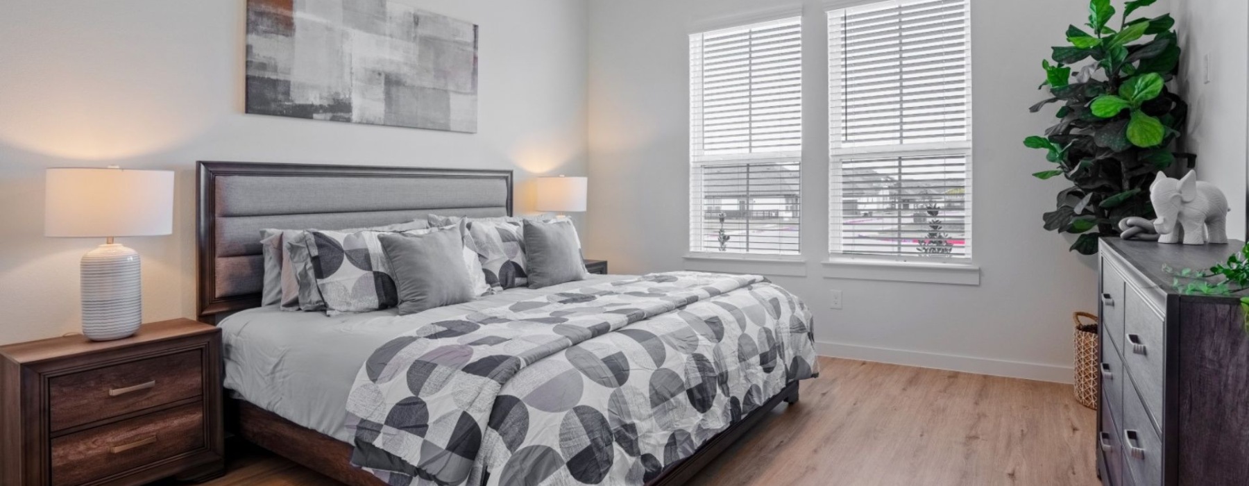 a bedroom with a bed and two nightstands