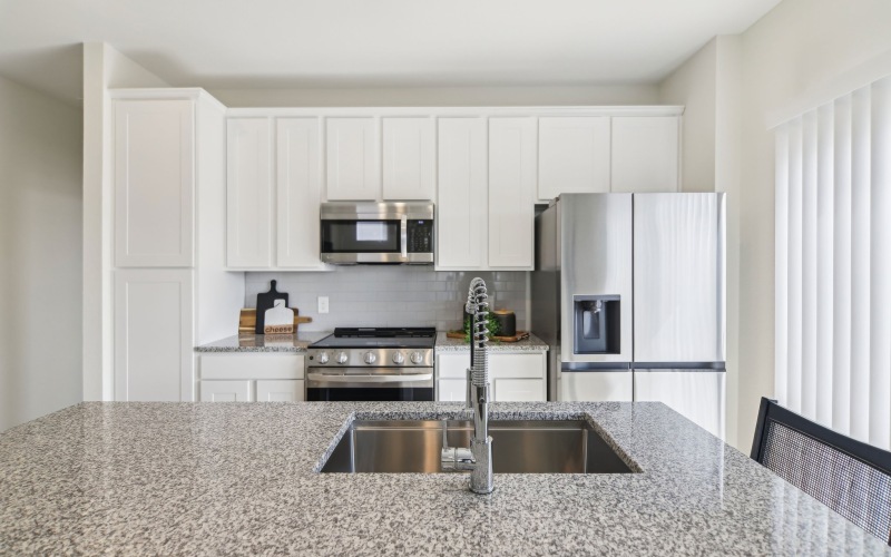 Kitchen with ample natural lighting and stainless appliances