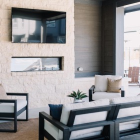 Find comfort in our outside patio outside patio and lounge area with seating and a TV